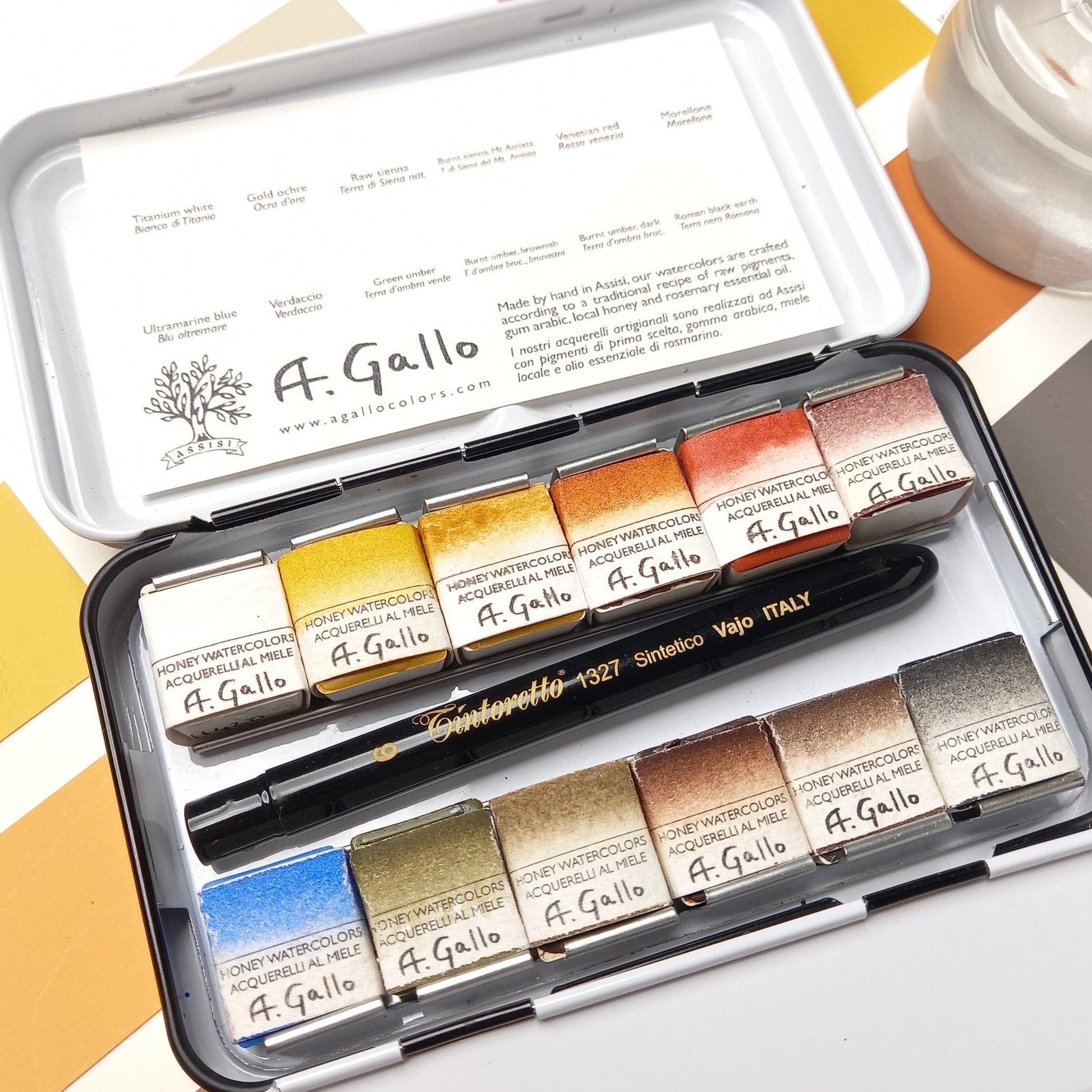 A. Gallo watercolor paint set with a pocket brush on a color swatch background