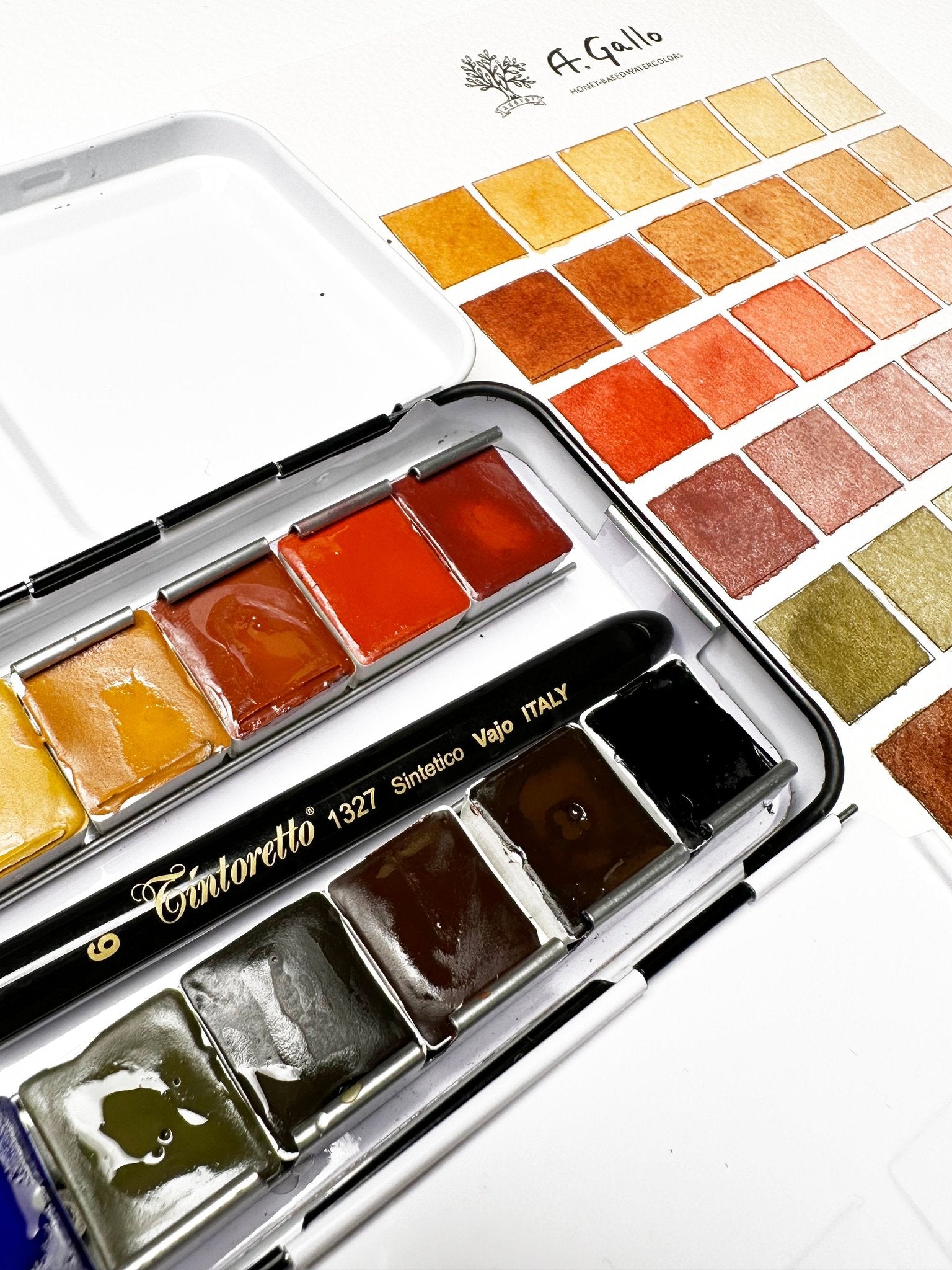 Watercolor paint set with a color swatch on a white background