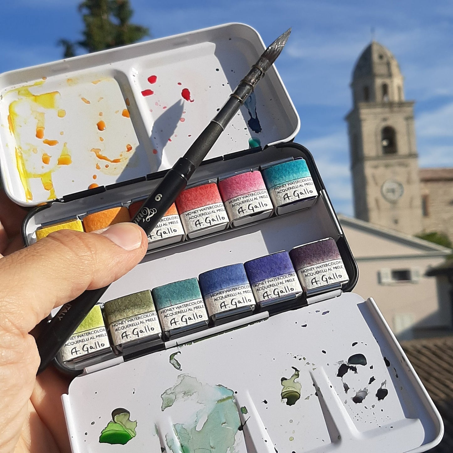 A. Gallo handmade watercolor tin held outdoors in Assisi, Italy