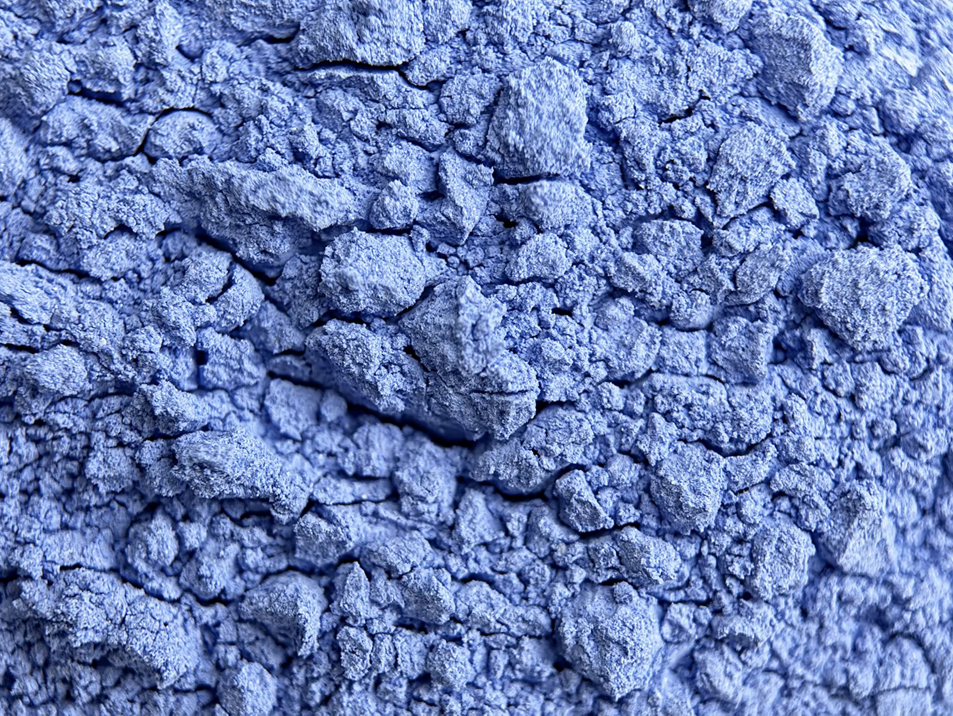 Close-up of blue powder with a crumbly texture