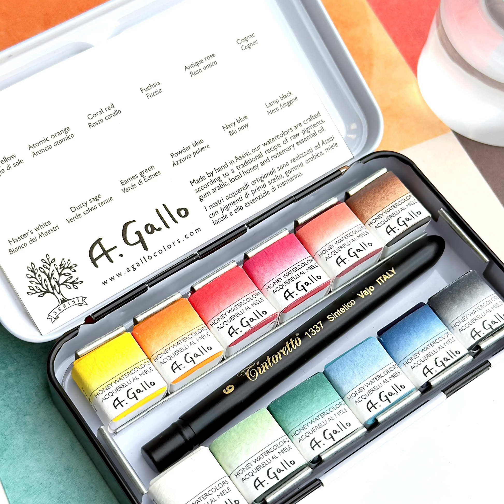 A. Gallo Mid-Century opaque watercolor set with open case on a colorful Modern Abstract painting background