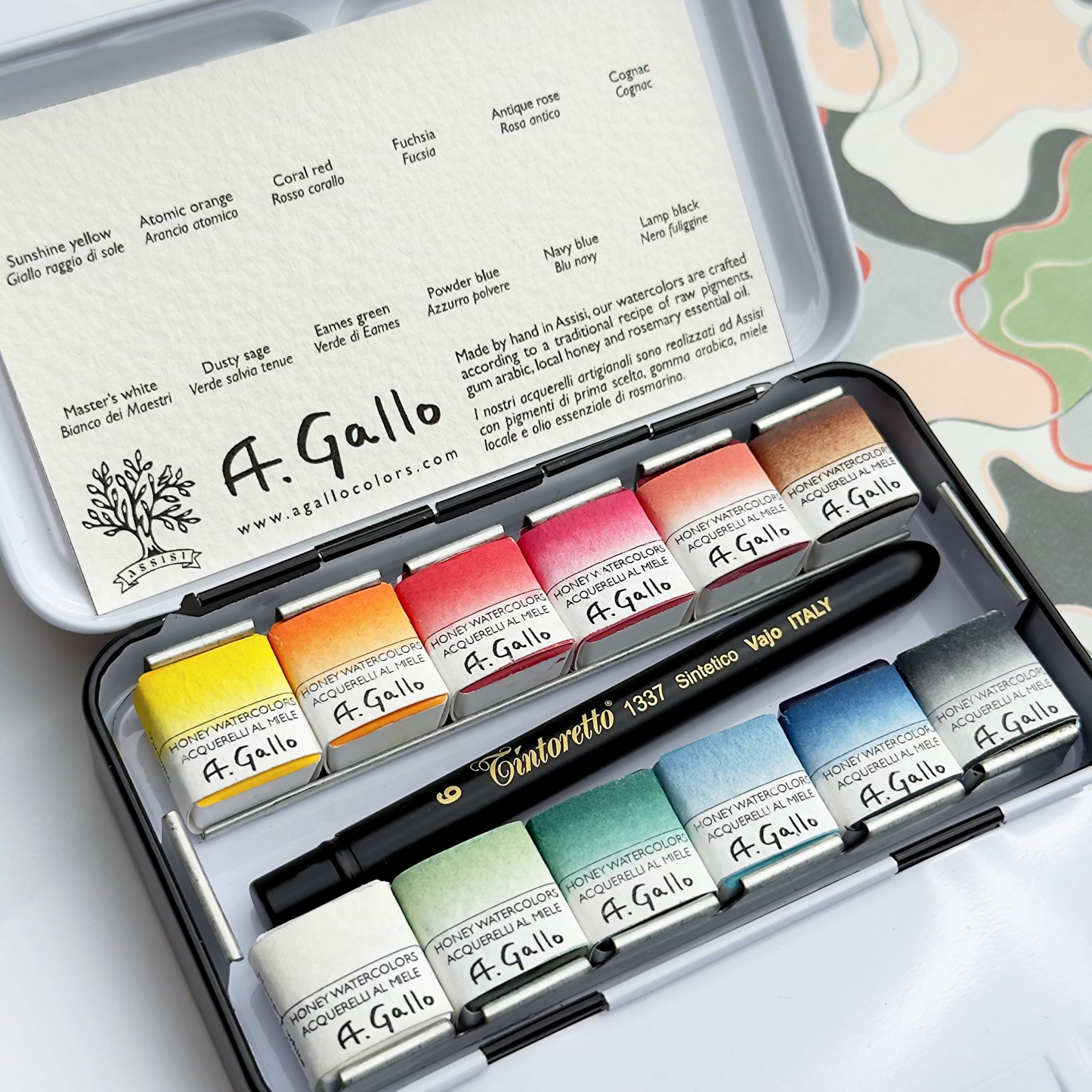 A. Gallo Mid-century watercolor paint set with various colors in a metal case.