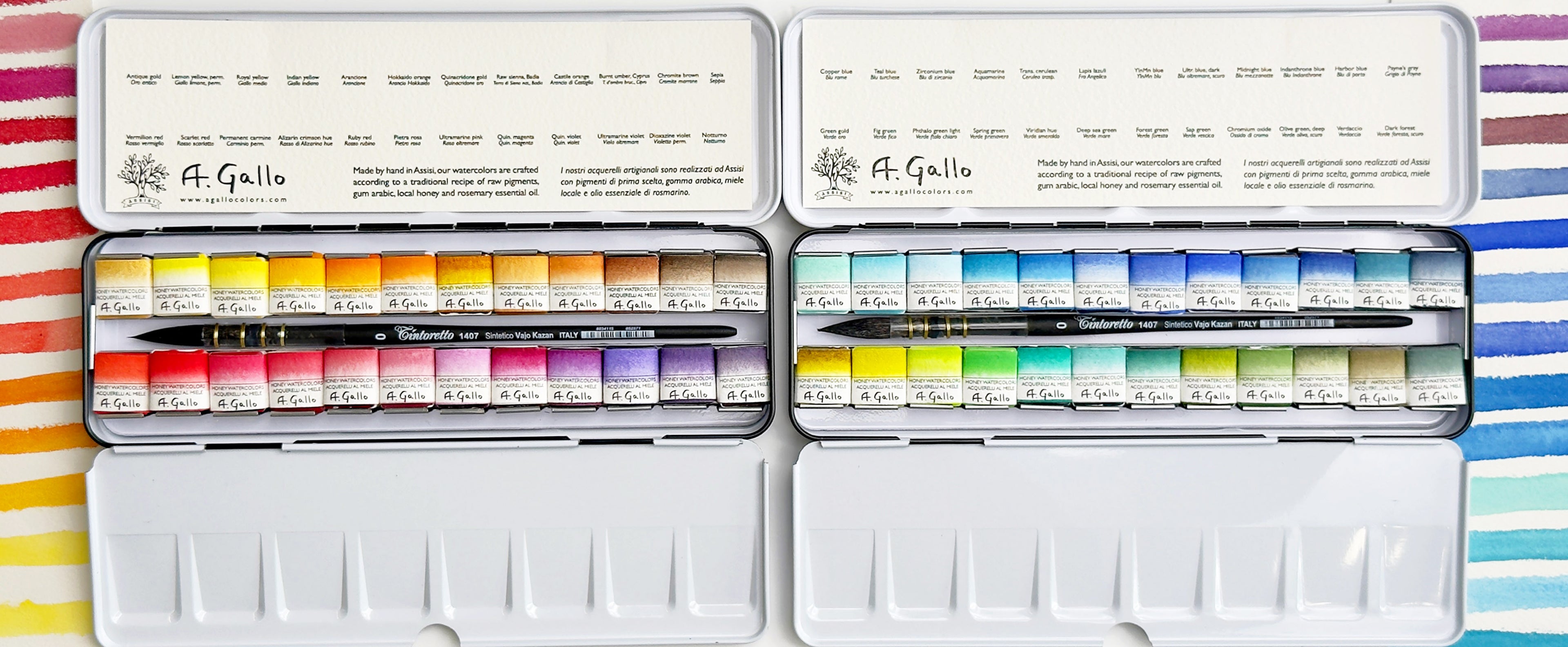Two open A. Gallo watercolor paint sets with multiple colorful paint tubes, displayed side by side on a striped fabric background.