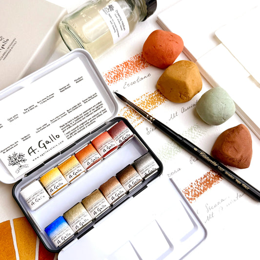 A Gallo watercolor paint set with a brush and color swatches on a white background