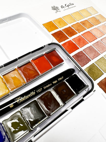 Watercolor paint set with a color swatch on a white background